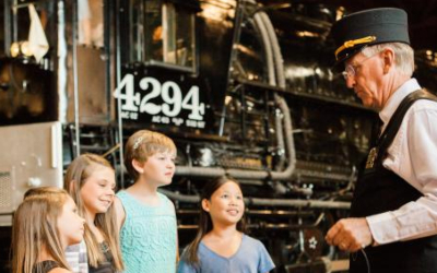 Train conductor talking to children